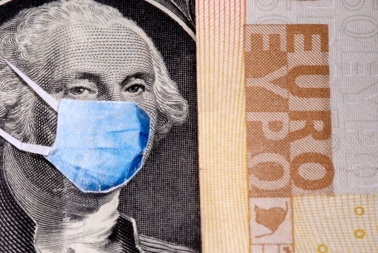 George Washington is seen with printed medical masks on the one Dollar near Euro banknote in this illustration