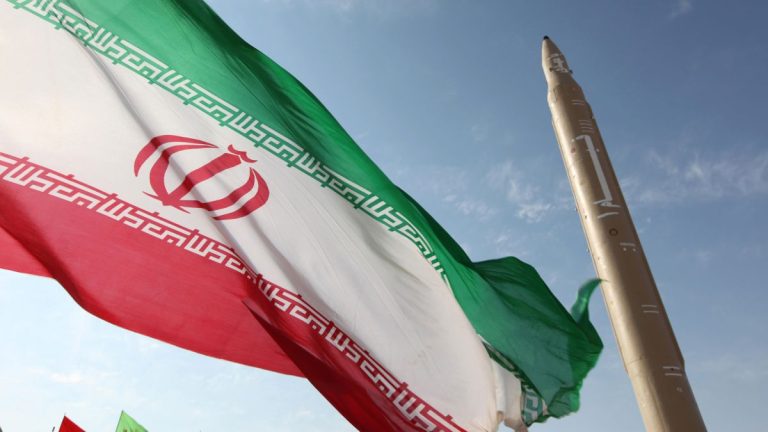 141125164236-iran-nuclear-talks-flag-missile